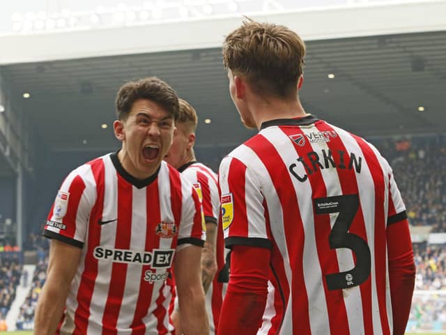 Luke O'Nien celebrates with Dennis Cirkin