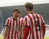 Luke O'Nien celebrates with Dennis Cirkin
