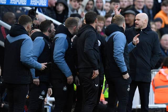 Manchester United's Dutch manager Erik ten Hag (R) has words with the Newcastle staff during the English Premier League football match between Newcastle United and Manchester United at St James' Park in Newcastle-upon-Tyne, north east England on April 2, 2023. (Photo by Oli SCARFF / AFP)
