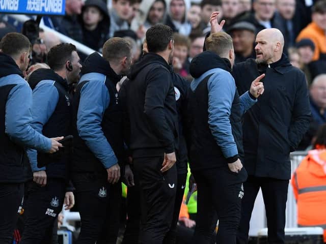 Manchester United's Dutch manager Erik ten Hag (R) has words with the Newcastle staff during the English Premier League football match between Newcastle United and Manchester United at St James' Park in Newcastle-upon-Tyne, north east England on April 2, 2023. (Photo by Oli SCARFF / AFP)