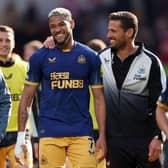 Joelinton and Jason Tindall, Assistant Head Coach of Newcastle United celebrate after the team's victory in the Premier League match between Brentford FC and Newcastle United at Brentford Community Stadium on April 08, 2023 in Brentford, England. (Photo by Alex Pantling/Getty Images)