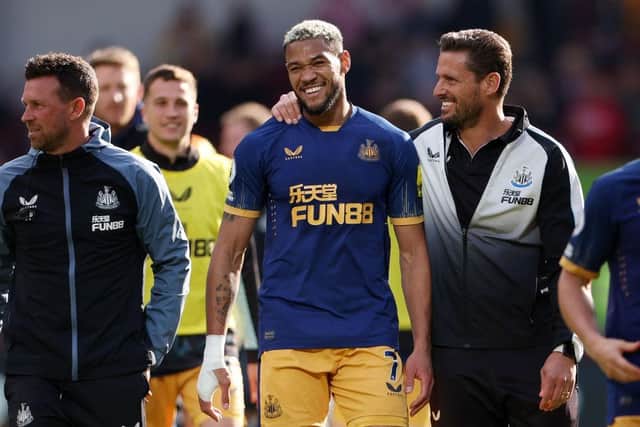 Joelinton and Jason Tindall, Assistant Head Coach of Newcastle United celebrate after the team's victory in the Premier League match between Brentford FC and Newcastle United at Brentford Community Stadium on April 08, 2023 in Brentford, England. (Photo by Alex Pantling/Getty Images)