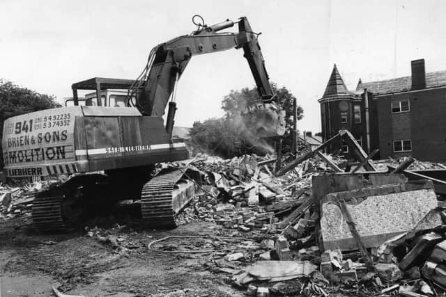 The end of an era as a digger clears another load of bricks and mortar away from the Ingham Infirmary which made way for housing in 1991.