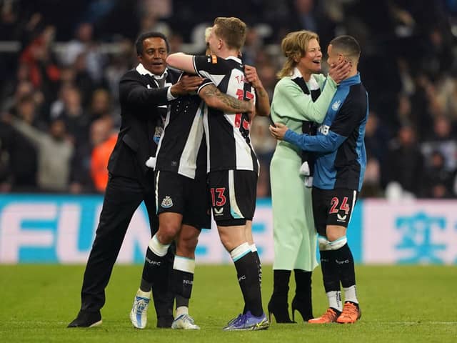 Newcastle United co-owner Amanda Staveley celebrates with Miguel Almiron as loanee Matt Targett embraces a team-mate in front of director Majed Al Sorour.