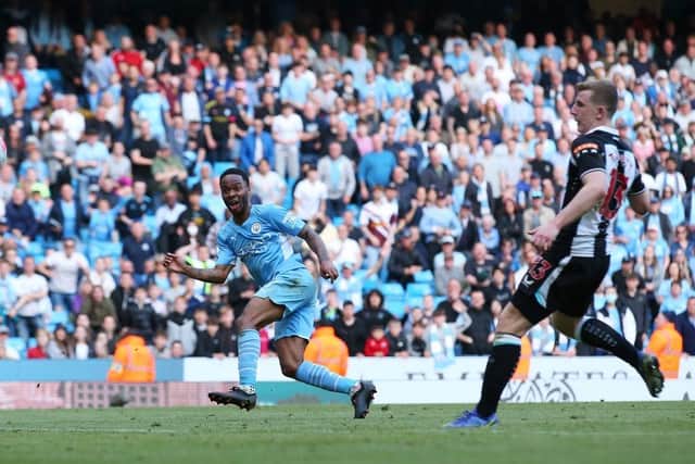 Raheem Sterling of Manchester City scores their side's fifth goal during the Premier League match between Manchester City and Newcastle United at Etihad Stadium on May 08, 2022 in Manchester, England. (Photo by Alex Livesey/Getty Images)