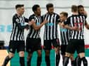 Newcastle United's English defender Jamaal Lascelles (R) celebrates with teammates after scoring the opening goal of the English Premier League football match between Newcastle United and Wolverhampton Wanderers at St James' Park in Newcastle-upon-Tyne, north east England on February 27, 2021.