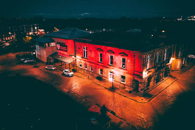 The Customs House lit up red in solidarity with the live entertainment industry. Photo credit: JORDAN EMBLETON/PHOTOBYJORDAN