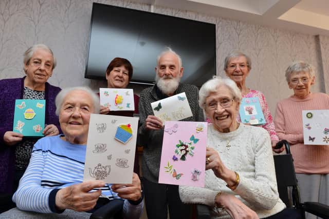 The residents with the cards they made.