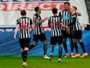 Newcastle United's English striker Dwight Gayle (R) celebrates with teammates after scoring their second goal during the English Premier League football match between Newcastle United and West Bromwich Albion at St James' Park in Newcastle-upon-Tyne, north east England on December 12, 2020.