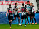 Newcastle United's English striker Dwight Gayle (R) celebrates with teammates after scoring their second goal during the English Premier League football match between Newcastle United and West Bromwich Albion at St James' Park in Newcastle-upon-Tyne, north east England on December 12, 2020.