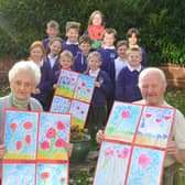 Hebburn Lakes Primary School donation of 100 poppies to Bedewell Grange Care Home. Residents Meg Ord and Bernard Johnson.