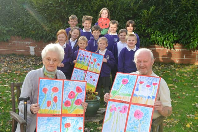 Hebburn Lakes Primary School donation of 100 poppies to Bedewell Grange Care Home. Residents Meg Ord and Bernard Johnson.