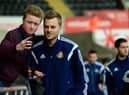 SWANSEA, WALES - FEBRUARY 07:  Sunderland player Sebastian Larsson has his picture taken with a fan before the Barclays Premier League match between Swansea City and Sunderland at Liberty Stadium on February 7, 2015 in Swansea, Wales.  (Photo by Stu Forster/Getty Images)