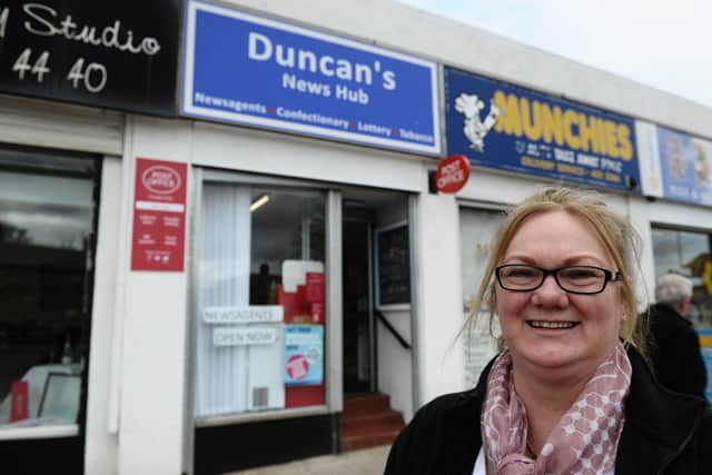 Madeline Duncan outside of Duncan's News Hub.