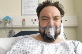 Colin pictured in hospital during his health scare.