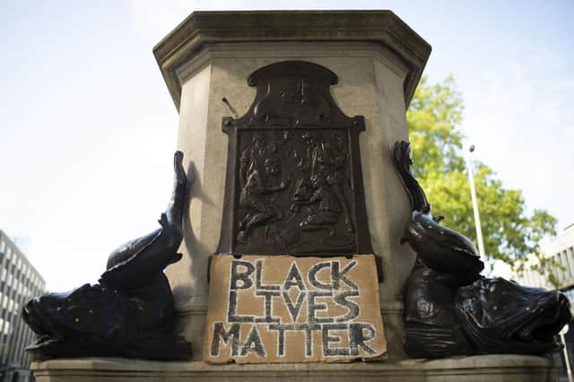 The Edward Colston statue plinth with a sign saying "Black Lives Matter" on June 16, 2020 in Bristol, England after the statue of the slave trader was pulled down.
