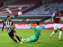 Lukasz Fabianski of West Ham United saves from Callum Wilson of Newcastle United during the Premier League match between West Ham United and Newcastle United at London Stadium on September 12, 2020 in London, England.