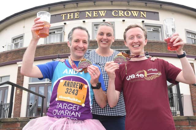Meggie Lowe, of the New Crown, still found a smile - despite the Great North Run's re-route being bad for business. Pictured with runners and regulars Andy Stringer and Ben Roach.