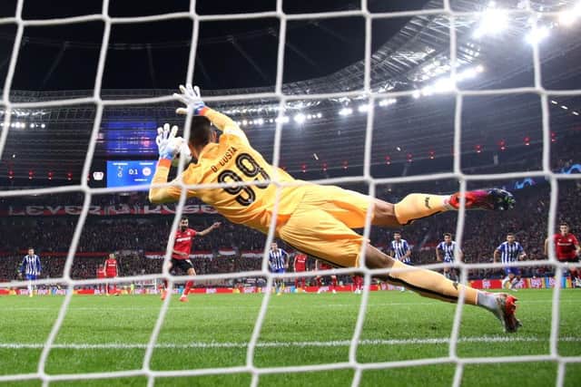 Diogo Costa of FC Porto saves a penalty kick  during the UEFA Champions League match between Bayer 04 Leverkusen and FC Porto (Photo by Alex Grimm/Getty Images)