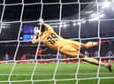 Diogo Costa of FC Porto saves a penalty kick  during the UEFA Champions League match between Bayer 04 Leverkusen and FC Porto (Photo by Alex Grimm/Getty Images)