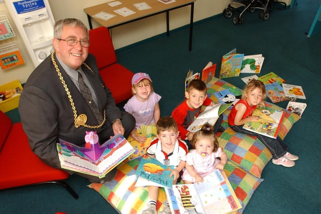 The opening of the new Early Excellence Centre 18 years ago with Mayor Coun John Wood leading the story time session.