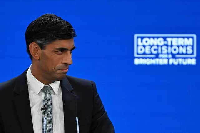 Prime Minister Rishi Sunak addresses delegates at the annual Conservative Party Conference. (Photo by JUSTIN TALLIS/AFP via Getty Images)