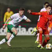 Niall Huggins of Wales U 21 controls the ball watched by Mason O'Malley of the Republic of Ireland U 21 during the International Friendly match between Wales U21 and Republic of Ireland U21 at Colliers Park on March 26, 2021 in Wrexham, Wales. (Photo by Clive Brunskill/Getty Images)