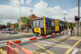 An old Tyne and Wear Metro train going over the level crossing at East Boldon. Photo: Nexus.