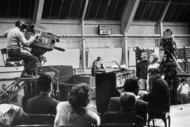 Buxton Advertiser archive, 1960 -  TV company ABC filming a sing along with Joe "Mr Piano" Henderson in the Ferodo factory at Chapel