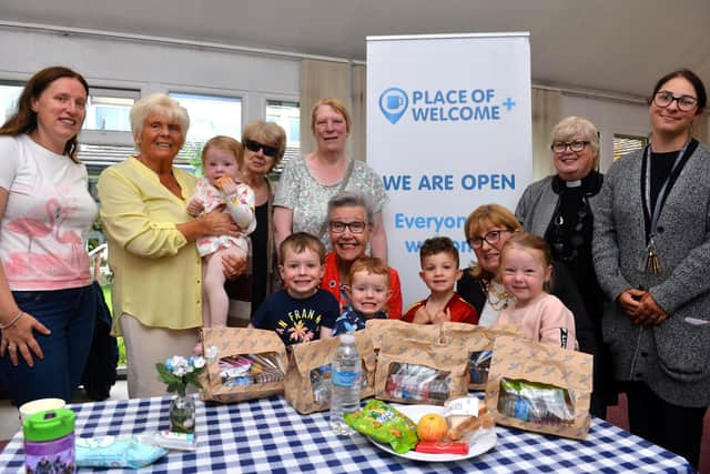 Mayor Cllr Pat Hay, seated left and mayoress Mrs Jean Copp, seated right, at Saint Peter's Church Centre pack lunch family initiative.