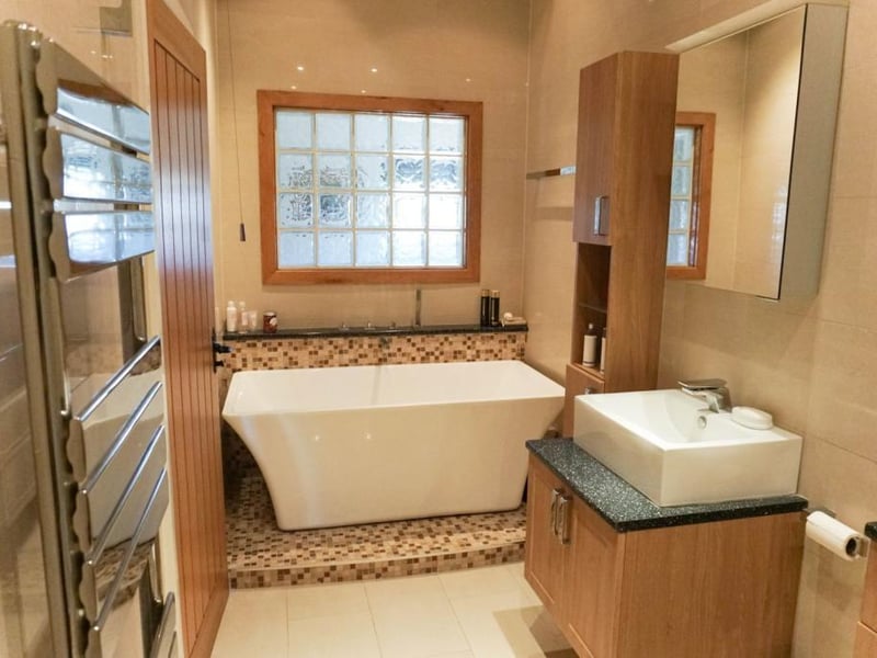 Four piece en suite bathroom with underfloor heating.