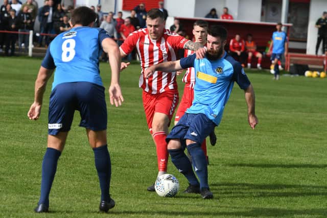 Seaham Red Star (red/white) v Hebburn Town (blue) at Seaham Town Park.