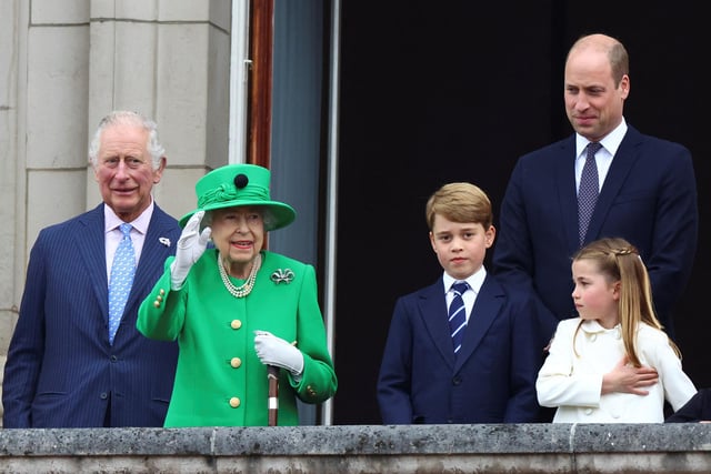 The Prince of Wales, Queen Elizabeth II, Prince George, the Duke of Cambridge and Princess Charlotte watch the parade from the balcony of Buckingham Palace