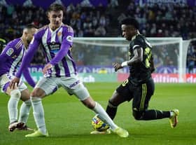 Real Valladolid's Spanish defender Ivan Fresneda (C) vies with Real Madrid's Brazilian forward Vinicius Junior during the Spanish League football match between Real Valladolid FC and Real Madrid CF at the Jose Zorilla stadium in Valladolid on December 30, 2022. (Photo by CESAR MANSO / AFP) (Photo by CESAR MANSO/AFP via Getty Images)