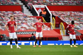 Harry Maguire of Manchester United looks dejected during the Premier League match between Manchester United and Tottenham Hotspur at Old Trafford on October 04, 2020( Photo by Oli Scarff - Pool/Getty Images)
