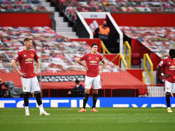 Harry Maguire of Manchester United looks dejected during the Premier League match between Manchester United and Tottenham Hotspur at Old Trafford on October 04, 2020( Photo by Oli Scarff - Pool/Getty Images)