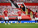 Harry Maguire of Manchester United looks dejected during the Premier League match between Manchester United and Tottenham Hotspur at Old Trafford on October 04, 2020( Photo by Oli Scarff - Pool/Getty Images)