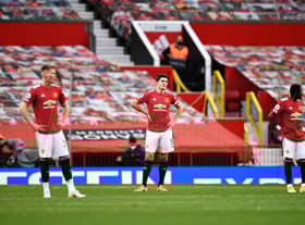 Harry Maguire of Manchester United looks dejected during the Premier League match between Manchester United and Tottenham Hotspur at Old Trafford on October 04, 2020( Photo by Oli Scarff - Pool/Getty Images)