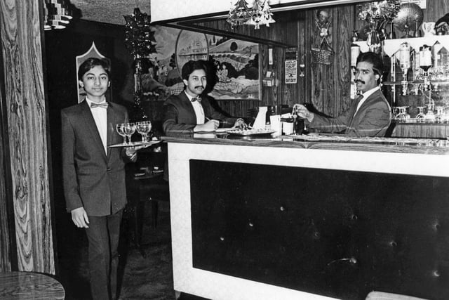 Farouk Hussein serves drinks from the new cocktail bar at the Shanti Tandoori 38 years ago.