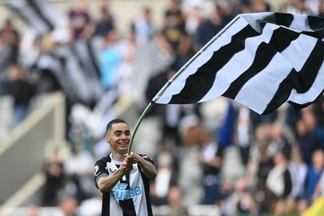 Miguel Almiron of Newcastle United waves a Newcastle United flag after their sides victory during the Premier League match between Newcastle United and Leicester City at St. James Park on April 17, 2022 in Newcastle upon Tyne, England. (Photo by Stu Forster/Getty Images)