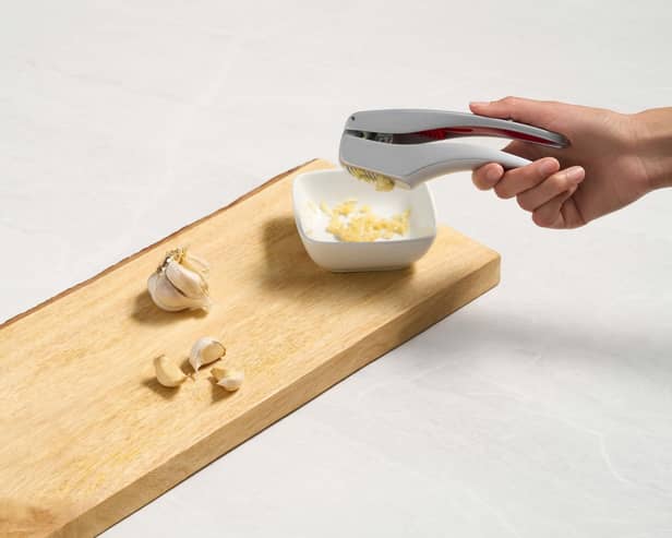 A garlic press in action