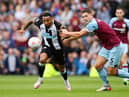 Callum Wilson of Newcastle United battles for possession with James Tarkowski of Burnley during the Premier League match between Burnley and Newcastle United at Turf Moor on May 22, 2022 in Burnley, England. (Photo by Gareth Copley/Getty Images)