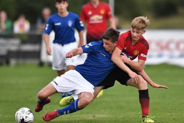 Rangers starlet Cole McKinnon in action against Manchester United (Photo by Charles McQuillan/Getty Images)