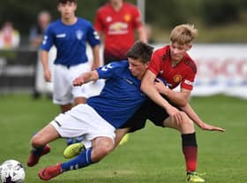 Rangers starlet Cole McKinnon in action against Manchester United (Photo by Charles McQuillan/Getty Images)