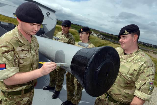 The team from 205 Battery putting the finishing touches to the gun in 2015.