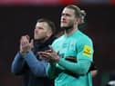 Newcastle United goalkeeper Loris Karius applauds fans after the game.