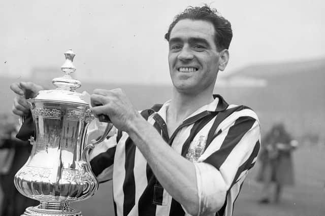 Newcastle United captain Joe Harvey shows off the FA Cup after his team's 1-0 victory PA Photo.