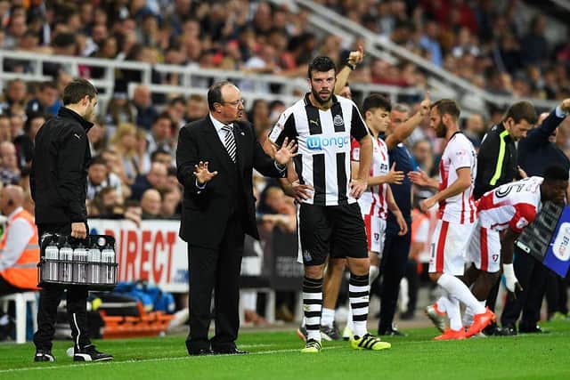 NEWCASTLE UPON TYNE, ENGLAND - AUGUST 23: Rafael Benitez, Manager of Newcastle United speaks to Grant Hanley of Newcastle United during the EFL Cup second round match between Newcastle United and Cheltenham Town at St. James' Park on August 23, 2016 in Newcastle upon Tyne, England. (Photo by Stu Forster/Getty Images)