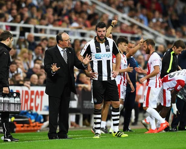 NEWCASTLE UPON TYNE, ENGLAND - AUGUST 23:  Rafael Benitez, Manager of Newcastle United speaks to Grant Hanley of Newcastle United during the EFL Cup second round match between Newcastle United and Cheltenham Town at St. James' Park on August 23, 2016 in Newcastle upon Tyne, England.  (Photo by Stu Forster/Getty Images)