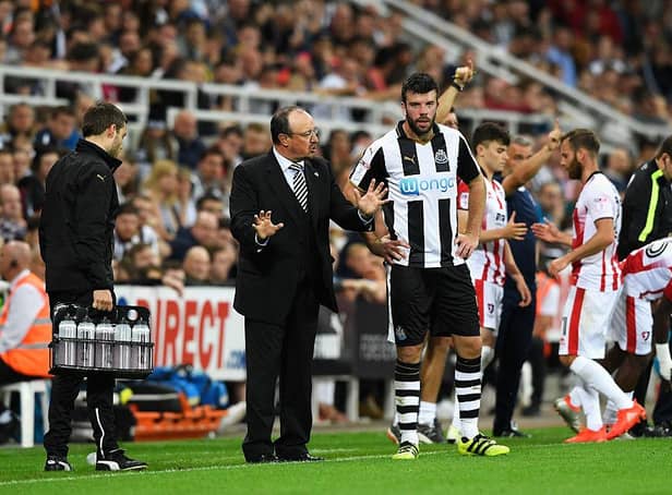 NEWCASTLE UPON TYNE, ENGLAND - AUGUST 23:  Rafael Benitez, Manager of Newcastle United speaks to Grant Hanley of Newcastle United during the EFL Cup second round match between Newcastle United and Cheltenham Town at St. James' Park on August 23, 2016 in Newcastle upon Tyne, England.  (Photo by Stu Forster/Getty Images)
